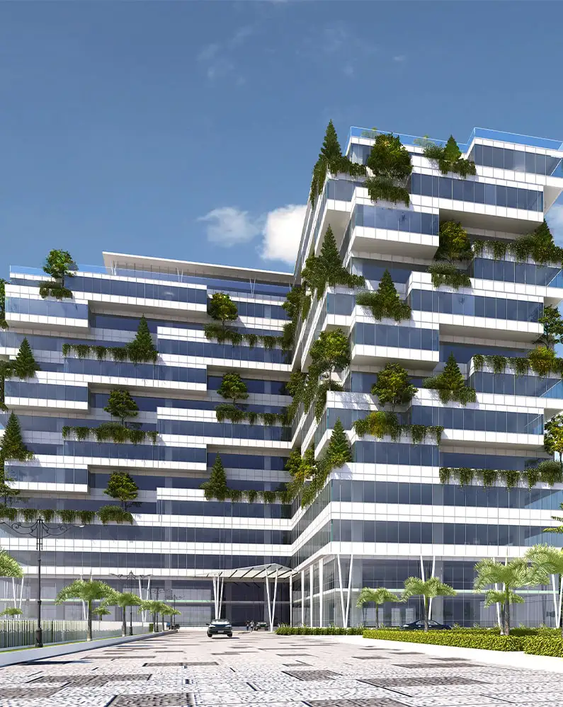 A large, modern multi-story residential project in Bangalore, showcasing an apartment building with distinctive white and blue facades, numerous balconies, and integrated greenery.