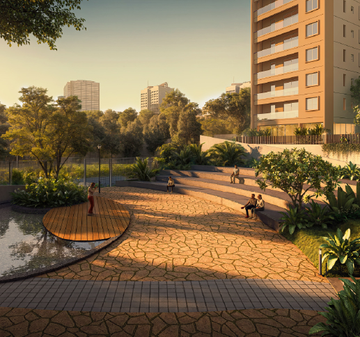 An outdoor communal area within a modern residential complex, featuring a tranquil pond with a circular wooden deck, stone-paved pathways - Mana Projects 